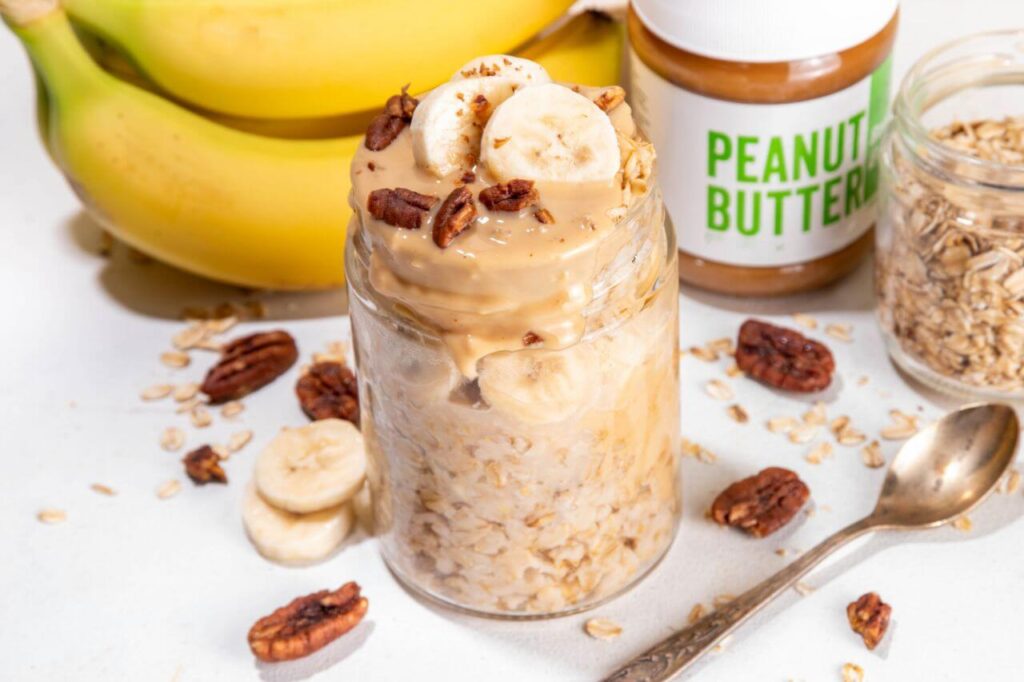 Jar of creamy peanut butter overnight oats with peanut butter drizzle