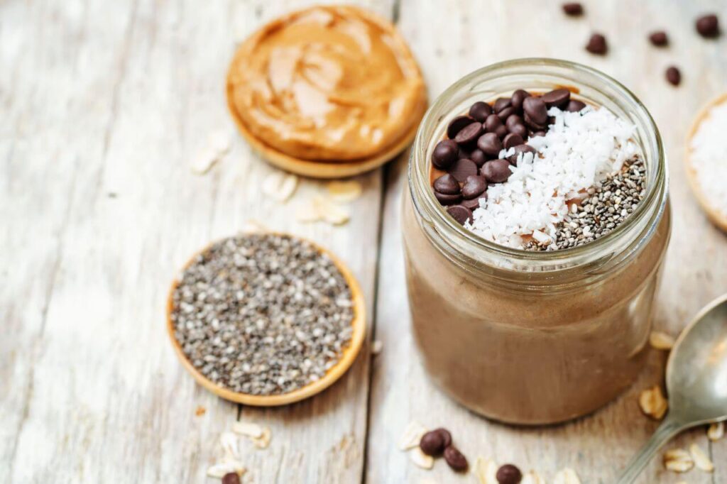 Ingredients for peanut butter overnight oats arranged on a counter